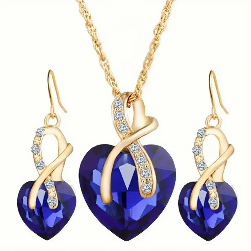 Ensemble collier et boucles d’oreilles en or avec cœur en saphir