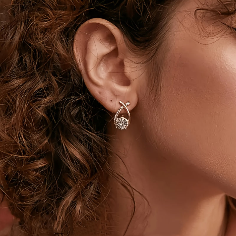 Boucles d’oreilles clous croix dorée en zirconium