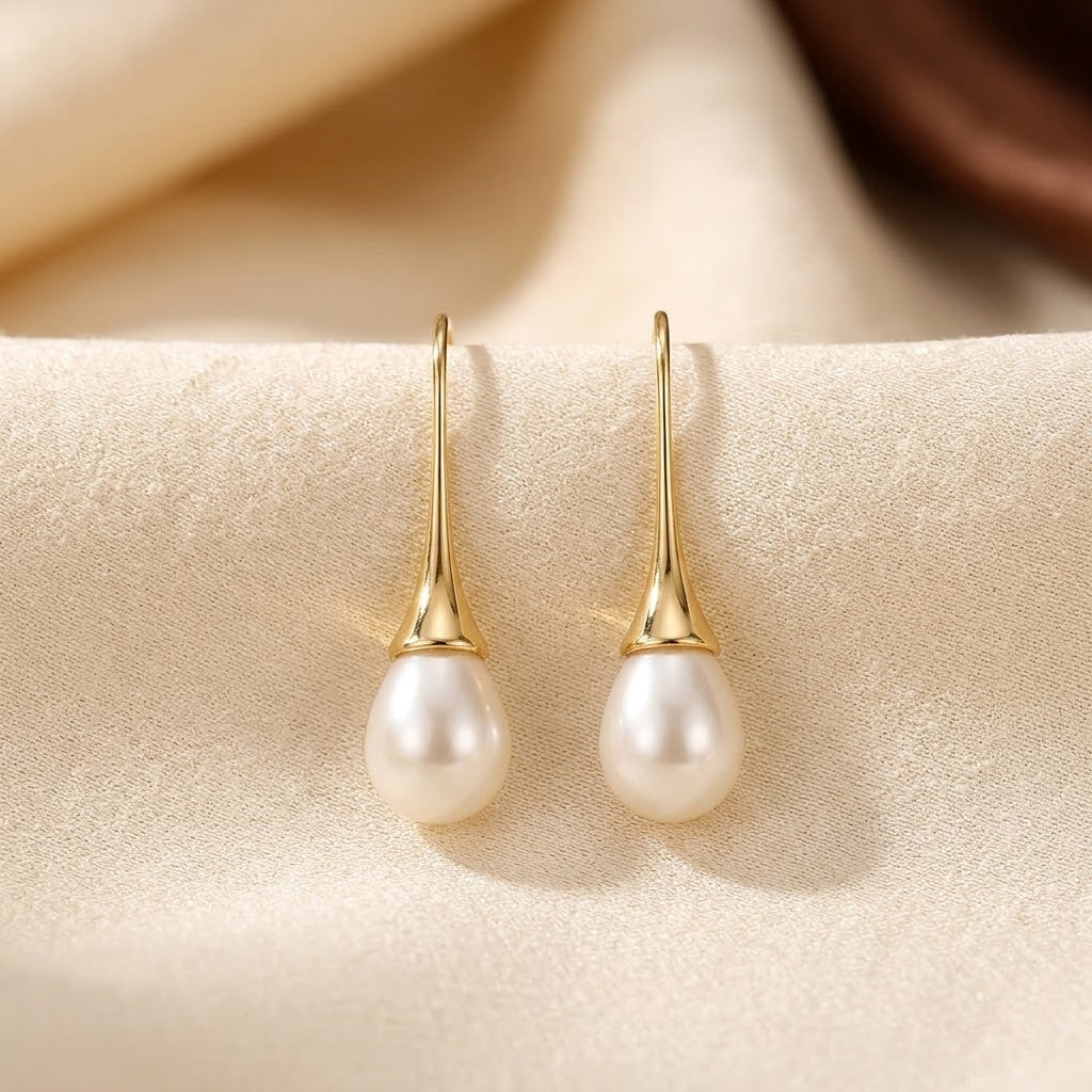 Boucles d'oreilles pendantes en or avec perle