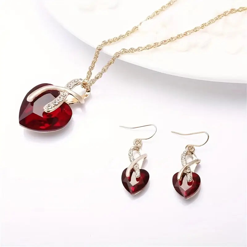 Ensemble de bijoux en or avec cœur torsadé et rubis