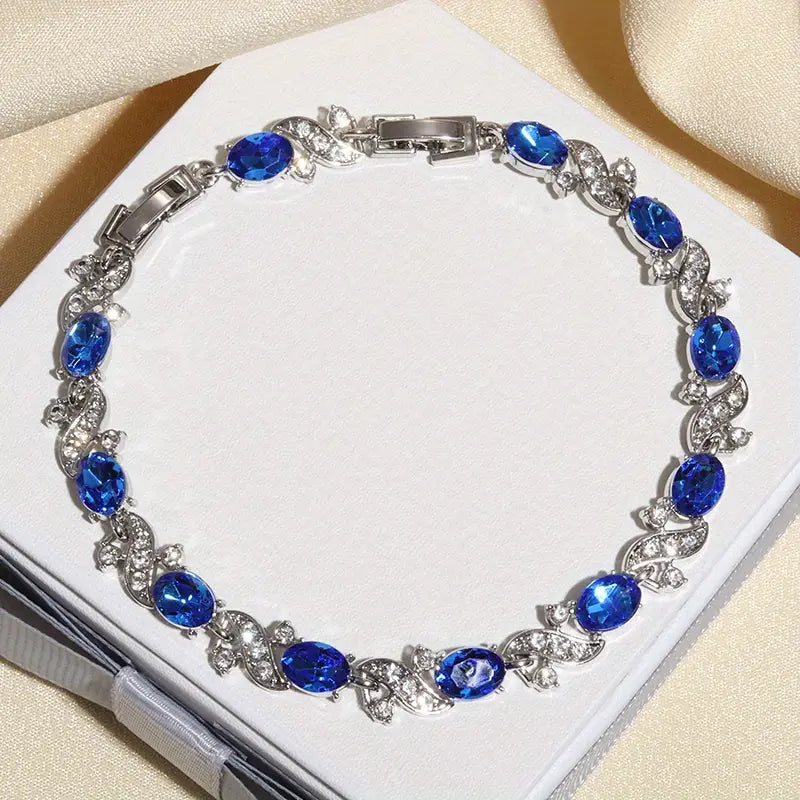 Bracelet à maillons floraux en argent avec saphir