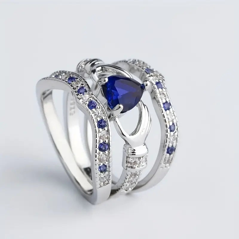 Bague entrelacée en argent avec saphir