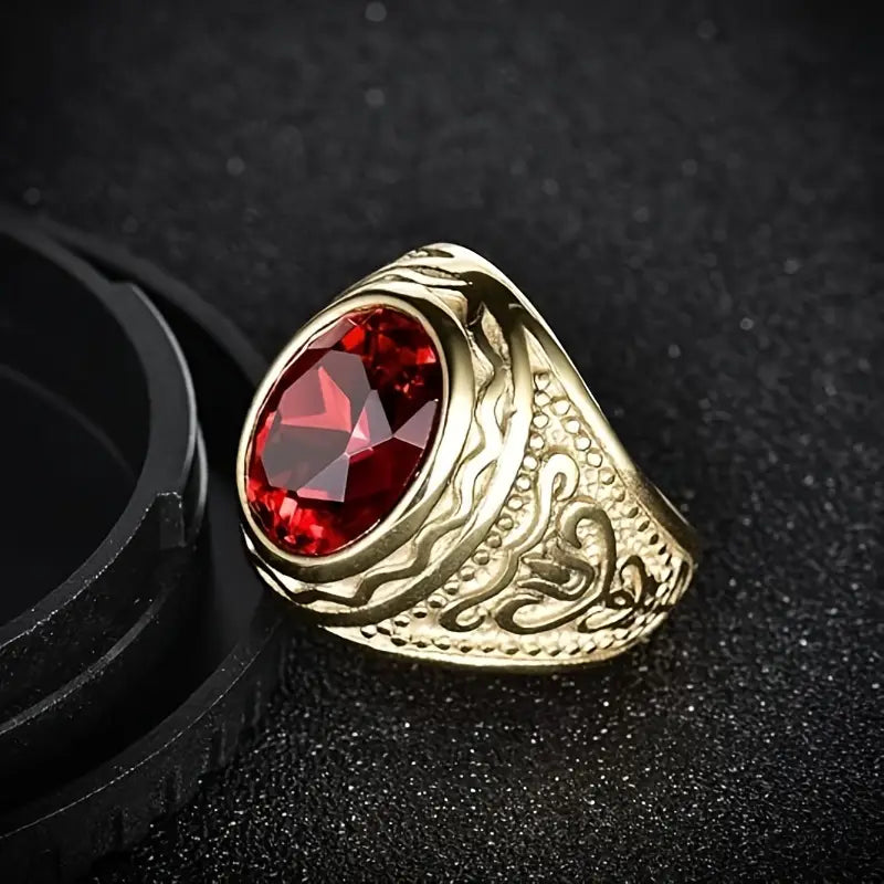 Bague gravée en or avec rubis