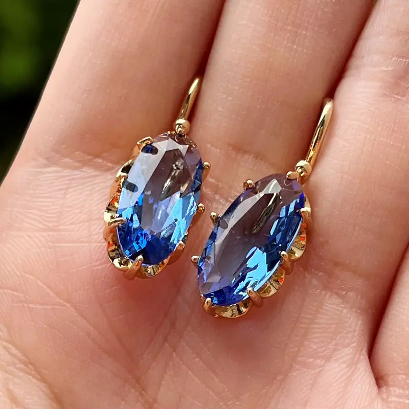 Boucles d’oreilles pendantes en or avec saphir