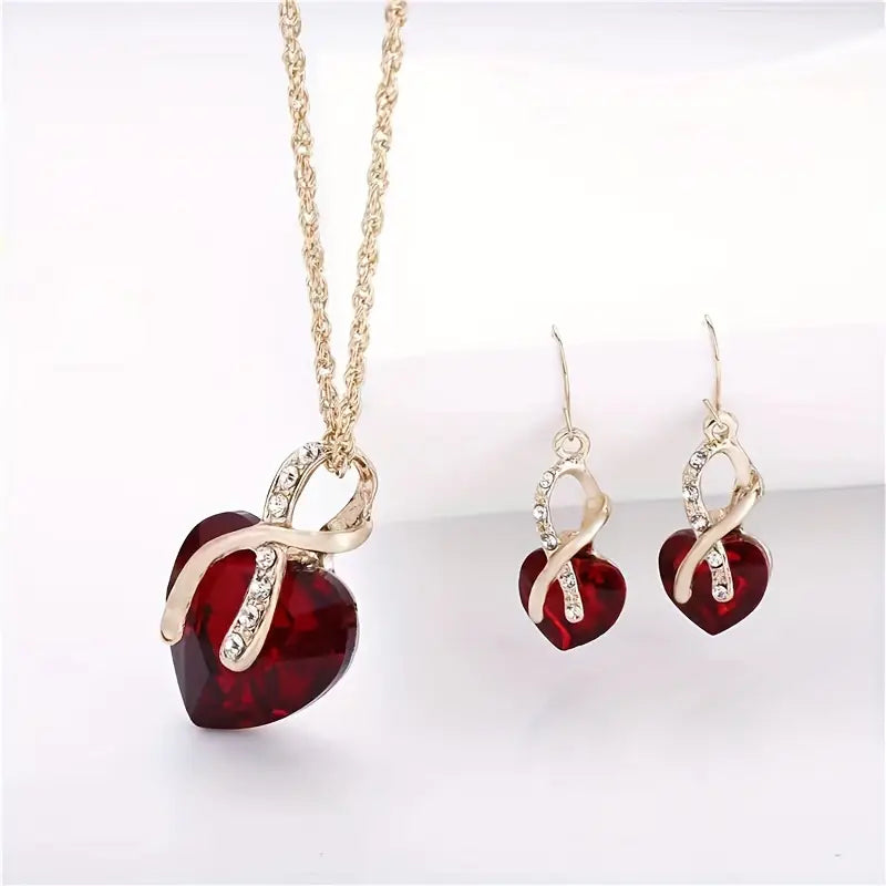 Ensemble de bijoux en or avec cœur torsadé et rubis