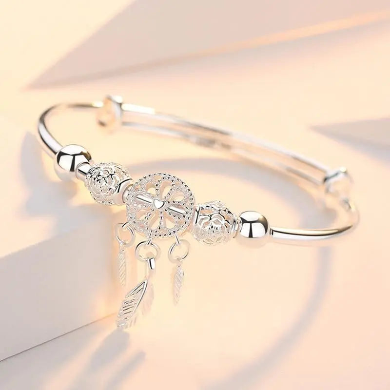 Bracelet à breloques capteur de rêves en argent