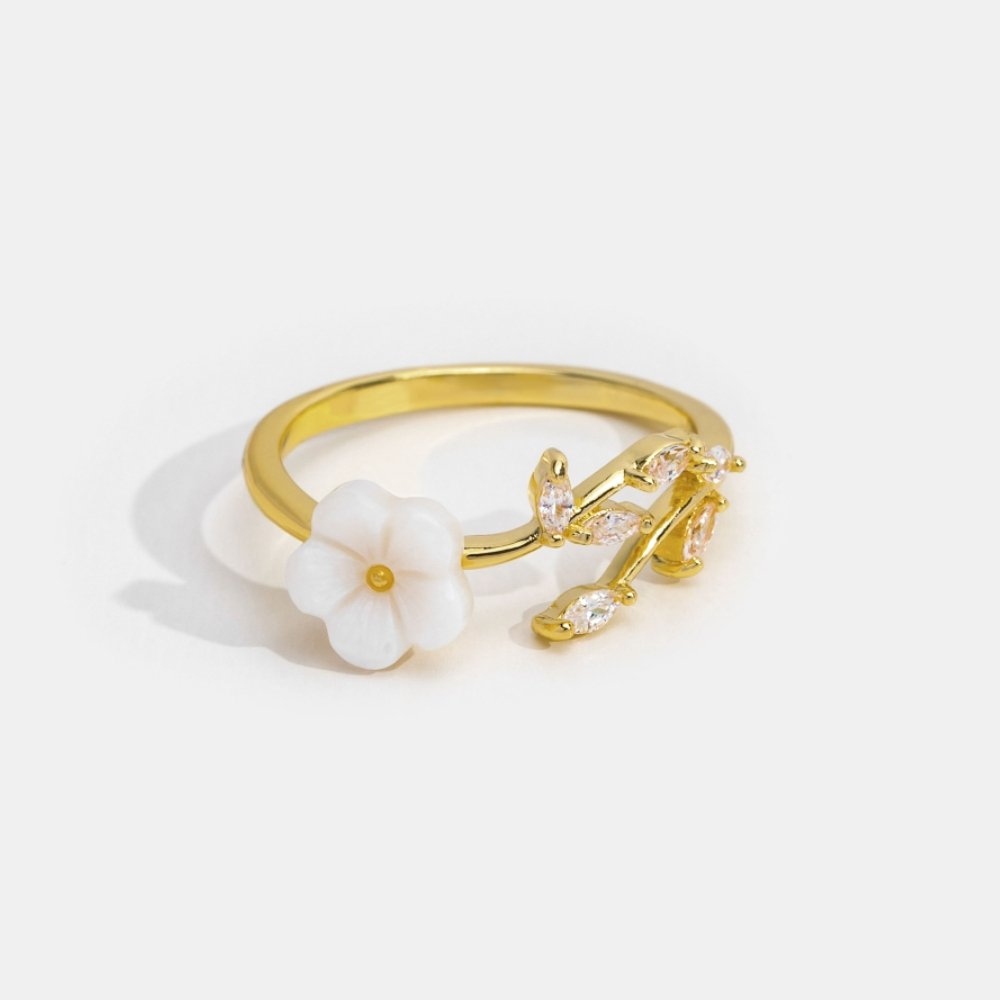 Bague ouverte en or avec motifs floraux et feuilles