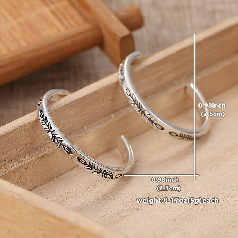 Boucles d’oreilles créoles argentées uniques