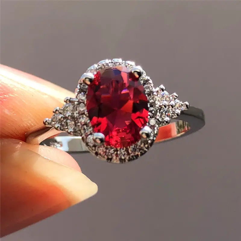 Bague halo en argent avec rubis