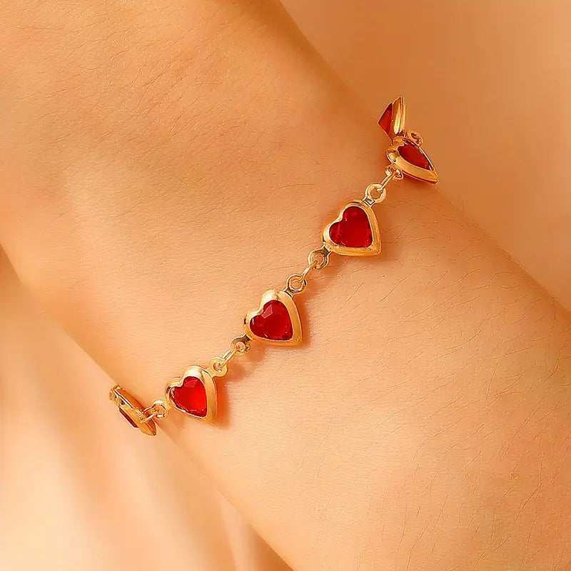 Bracelet chaîne en or avec cœur en rubis