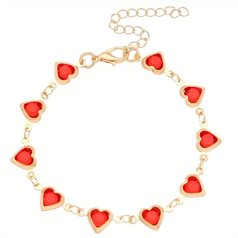 Bracelet chaîne en or avec cœur en rubis