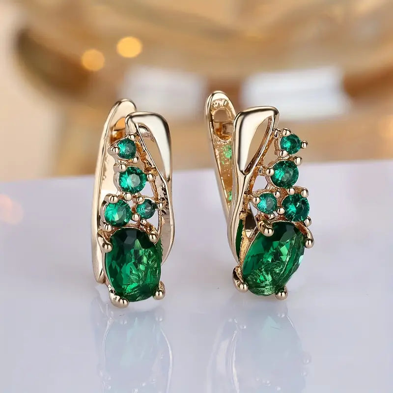 Boucles d'oreilles pendantes grappe d'émeraudes dorées