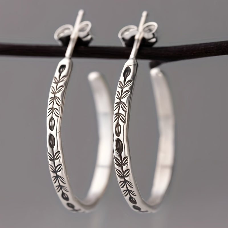 Boucles d’oreilles créoles argentées uniques