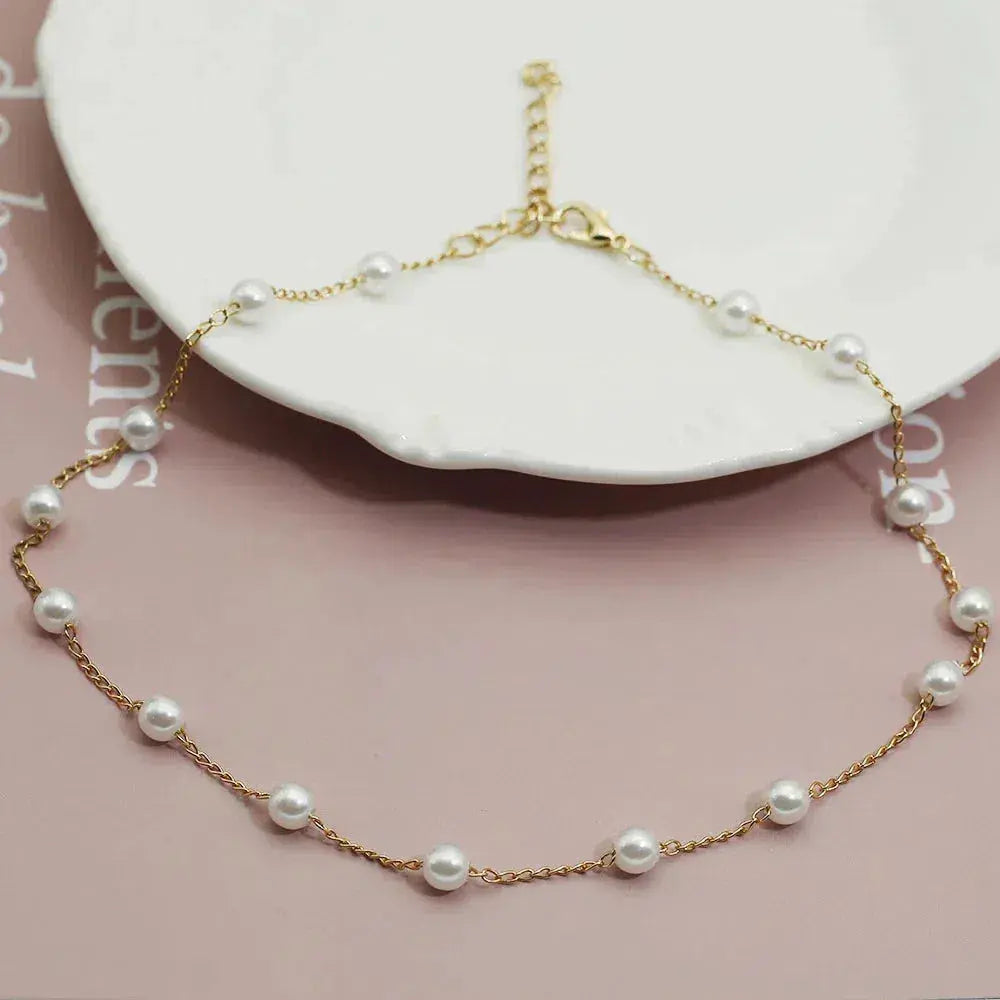 Collier chaîne en or avec perles espacées
