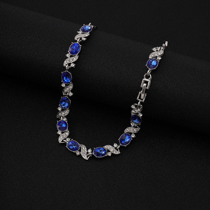 Bracelet à maillons floraux en argent avec saphir