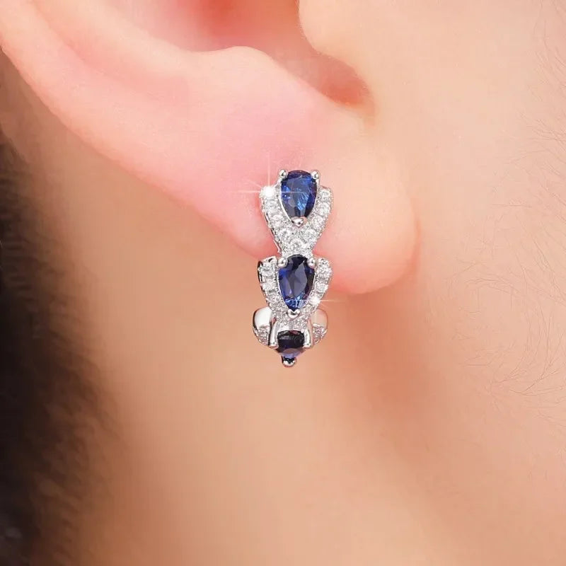 Boucles d’oreilles créoles halo en argent avec saphir