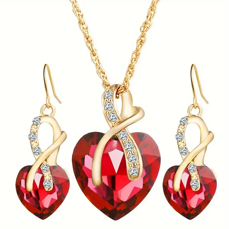 Ensemble de bijoux en or avec cœur torsadé et rubis