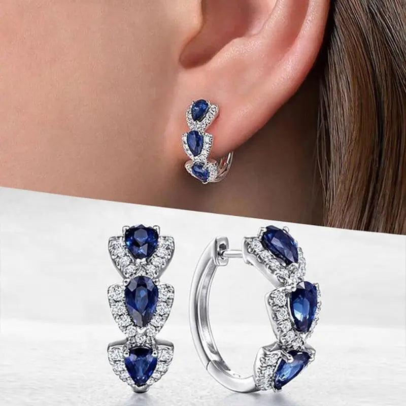 Boucles d’oreilles créoles halo en argent avec saphir