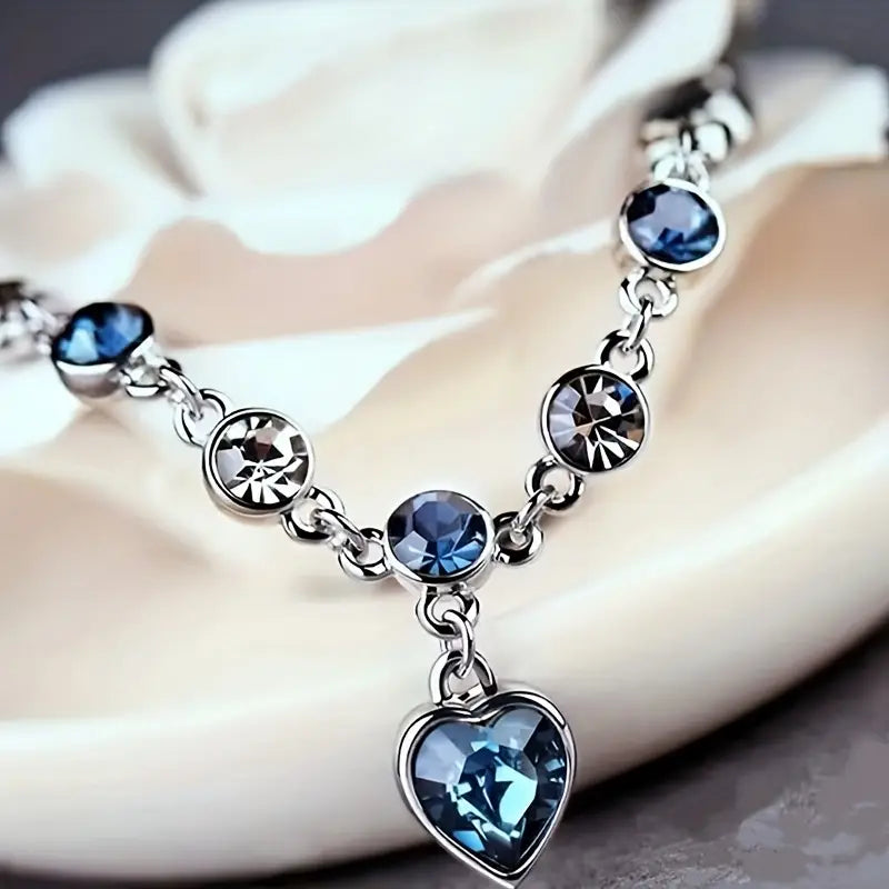 Bracelet chaîne en argent avec cœur en saphir