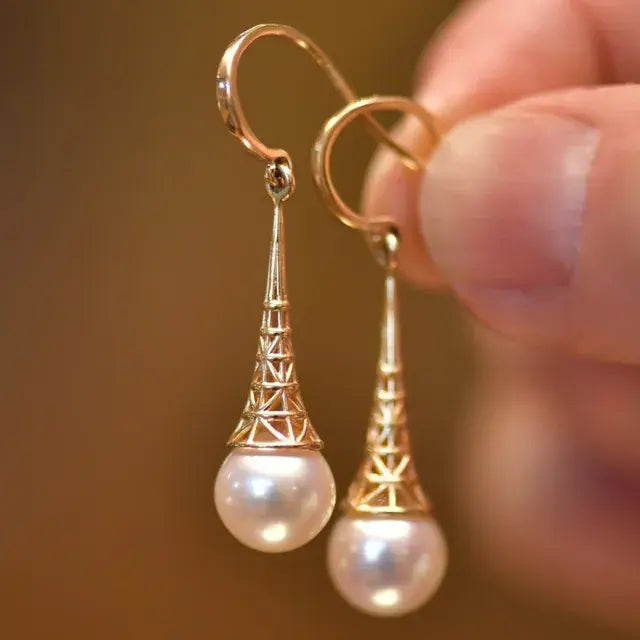 Boucles d’oreilles pendantes en or filigrané avec perle