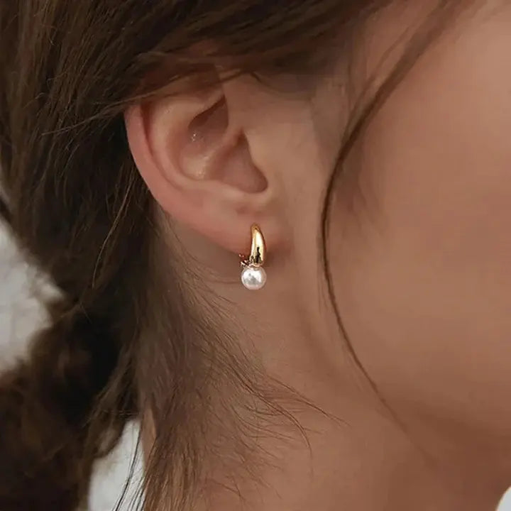 Boucles d’oreilles créoles en or avec perles