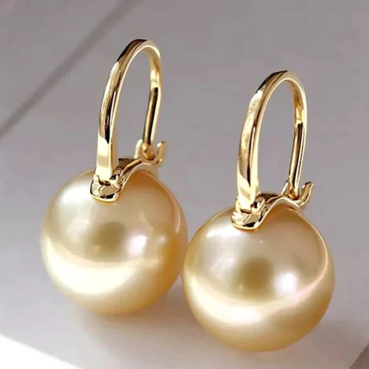 Boucles d’oreilles élégantes dorées avec perles